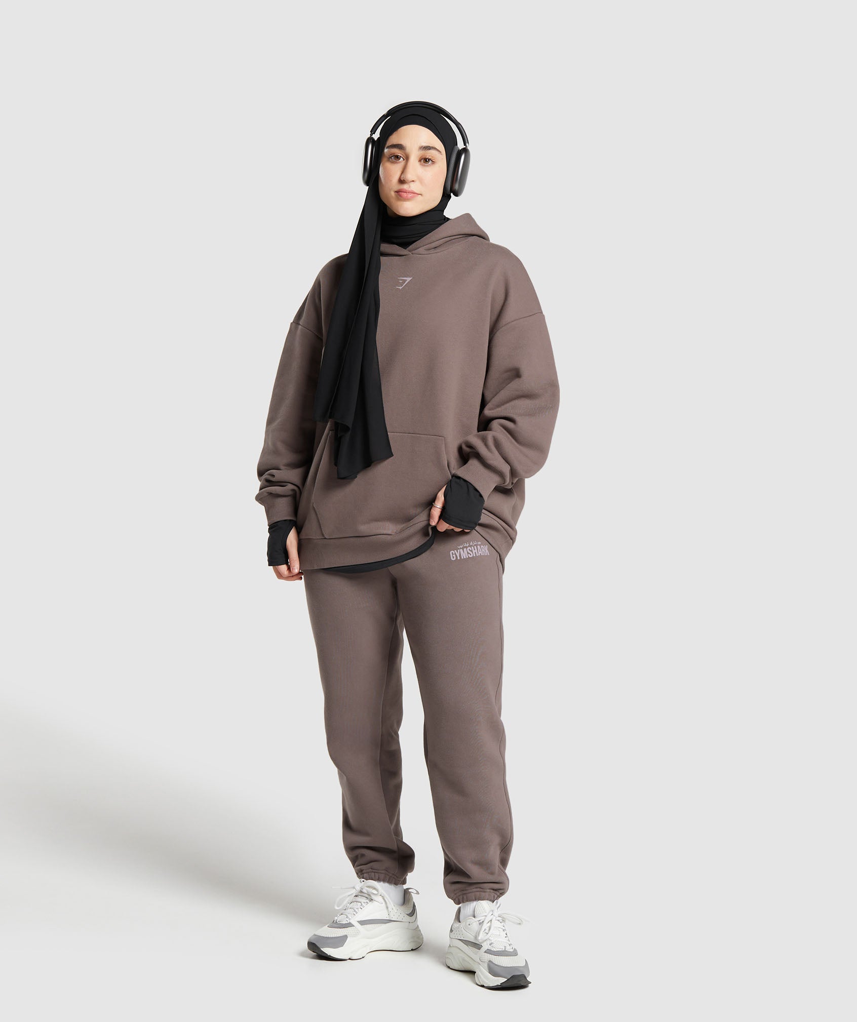 GYMSHARK GS X Leana Deeb Cozy Oversized Streetwear Hooded Sweatshirt with Graphic Print - Vintage Brown Casual Wear 
