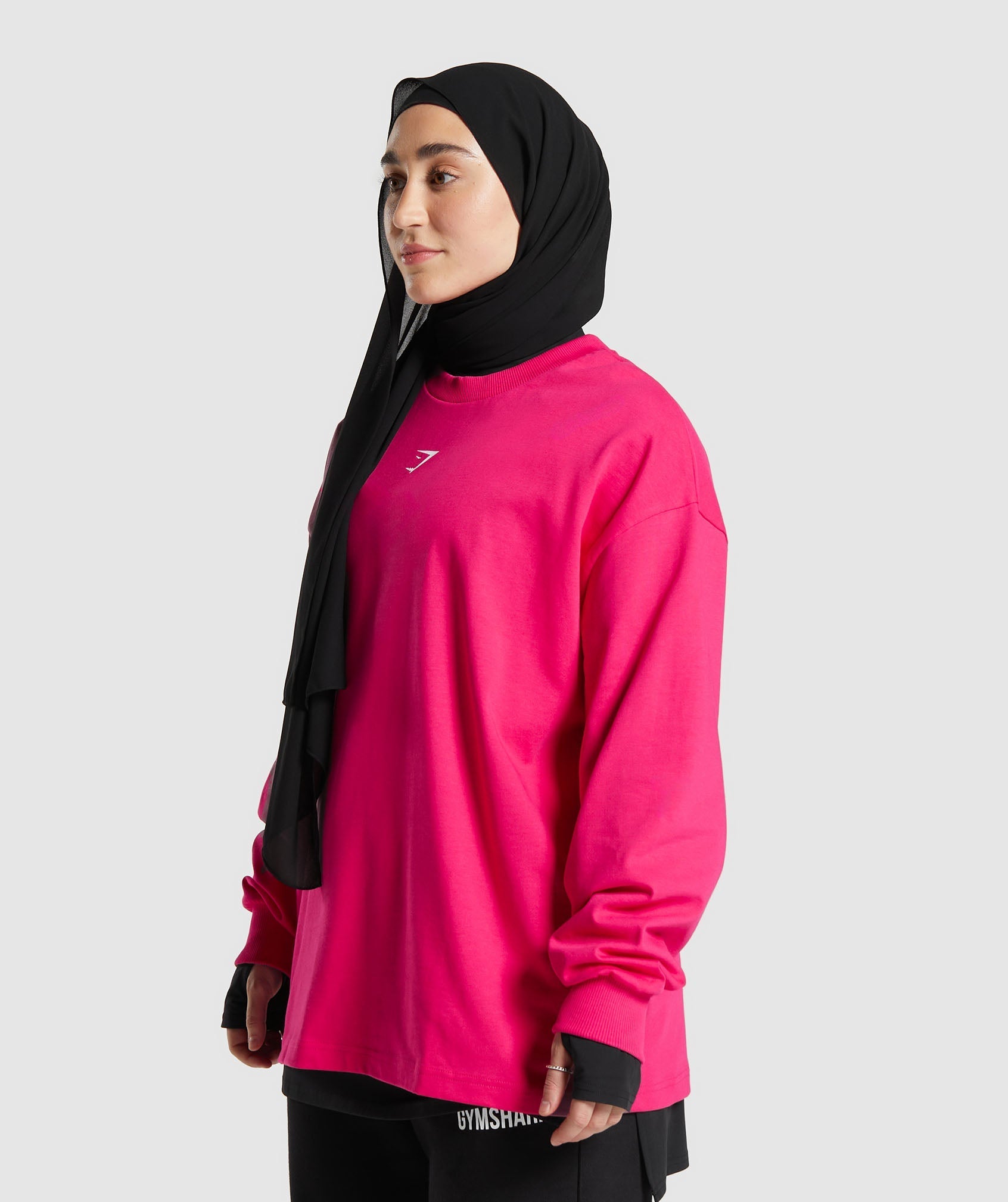 GYMSHARK GS X Leana Deeb Streetwear-Inspired Graphic Tee - Oversized Longline Cut in Bold Pink 