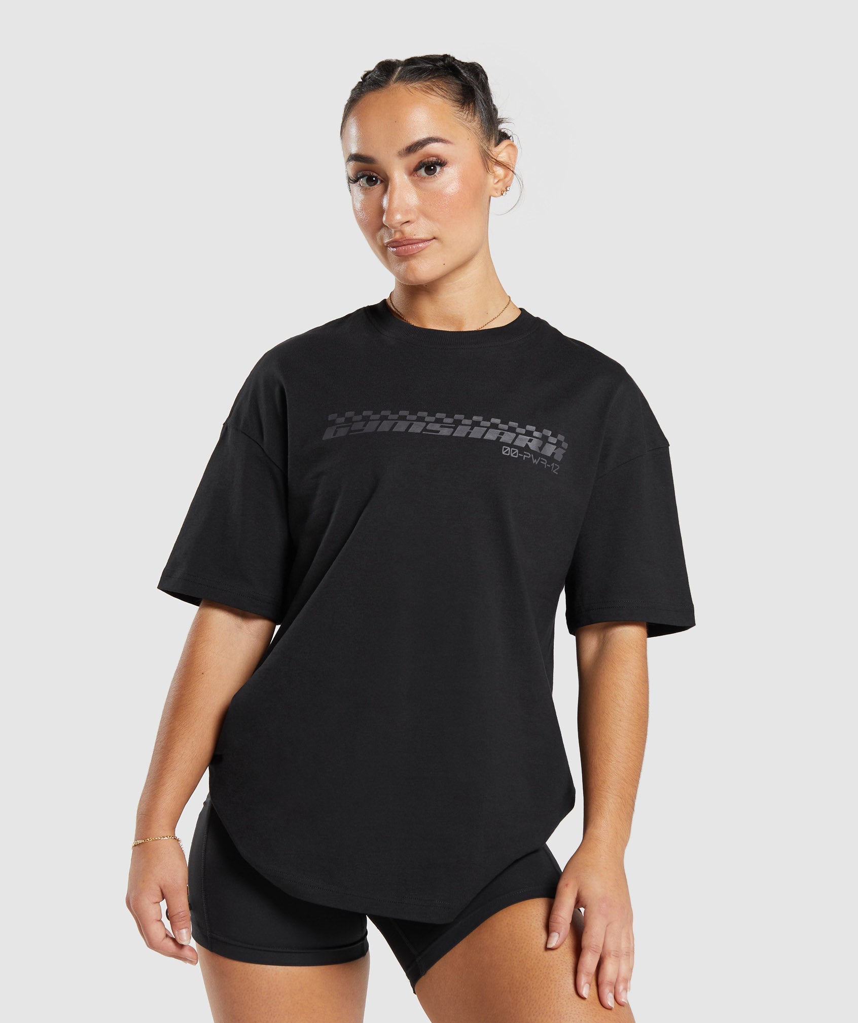GYMSHARK Men's Motocross-Inspired Distressed Graphic Tee - Oversized Streetwear Essential in Black